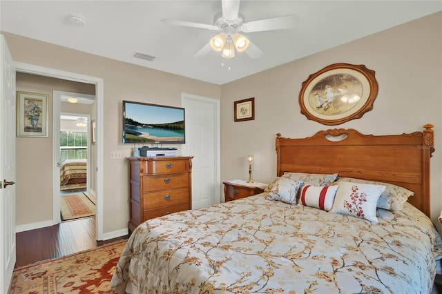 bedroom with hardwood / wood-style flooring and ceiling fan