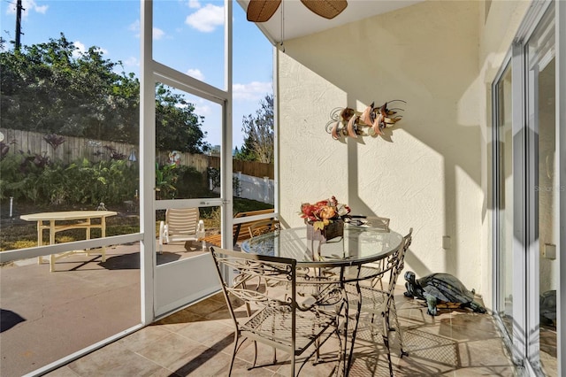 sunroom / solarium with ceiling fan