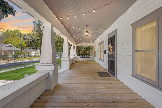 wooden terrace featuring covered porch