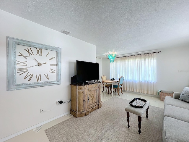 living room featuring a textured ceiling