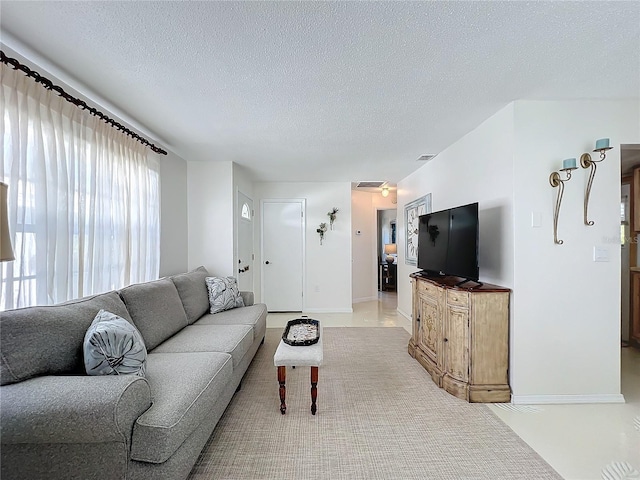 living room with a textured ceiling