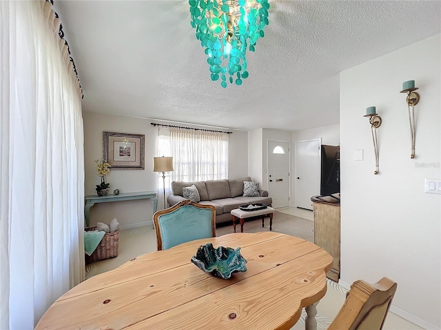 dining area with a textured ceiling