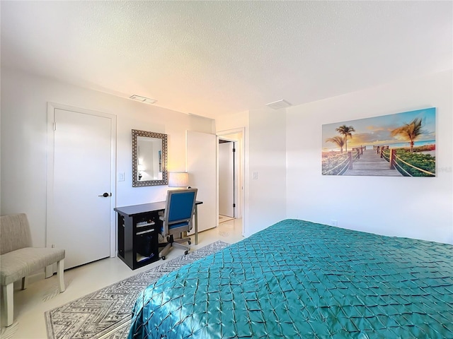 bedroom featuring a textured ceiling