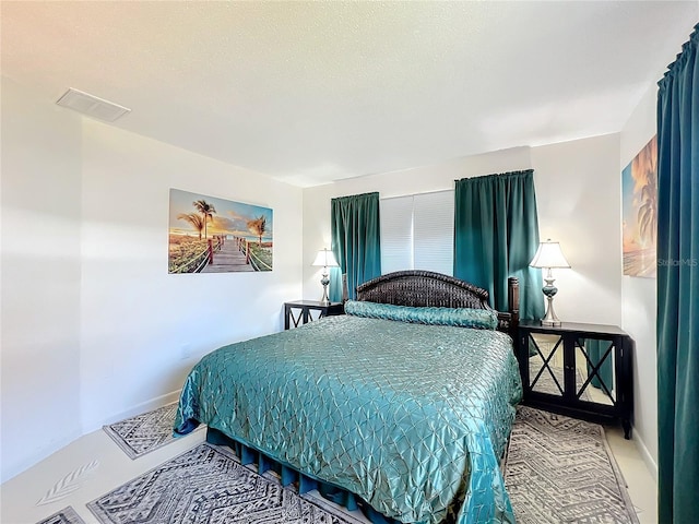 bedroom featuring a textured ceiling