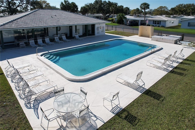 view of swimming pool featuring a patio area