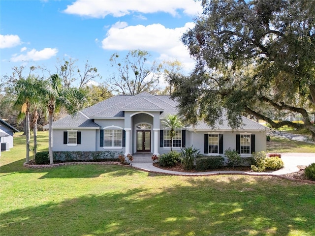 ranch-style house featuring a front lawn