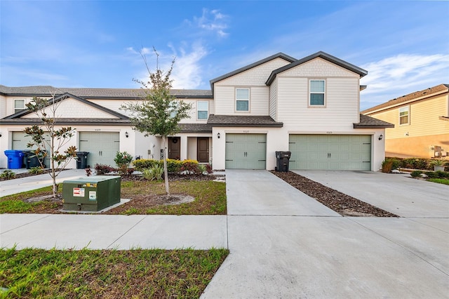 view of front of house featuring concrete driveway and a garage