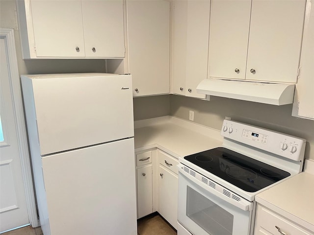 kitchen with white appliances and white cabinets