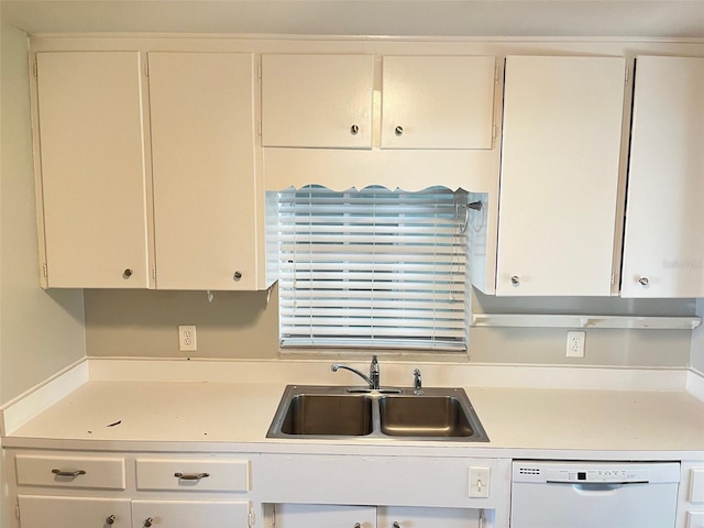 kitchen with white cabinetry, dishwasher, and sink