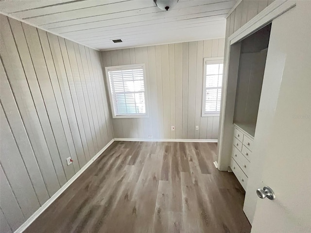 unfurnished bedroom with hardwood / wood-style floors