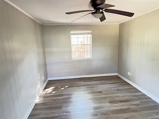 spare room featuring ceiling fan, crown molding, and dark hardwood / wood-style flooring