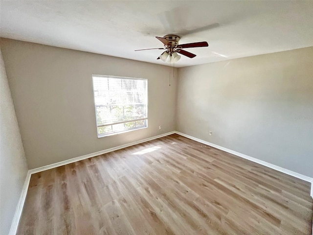 unfurnished room with ceiling fan and light hardwood / wood-style flooring