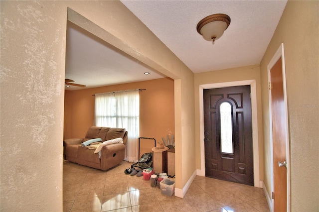 foyer featuring light tile patterned floors