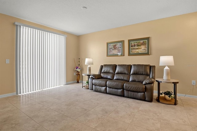 tiled living room with a textured ceiling