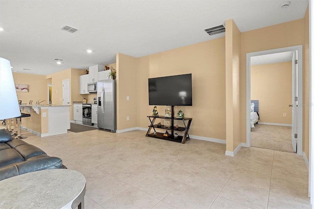 living room with light tile patterned flooring