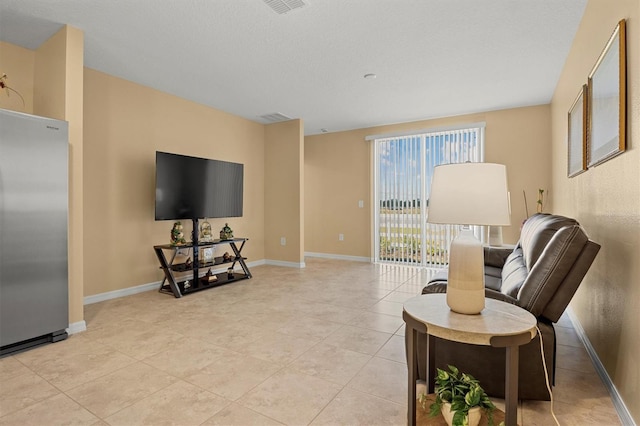 living area with light tile patterned floors