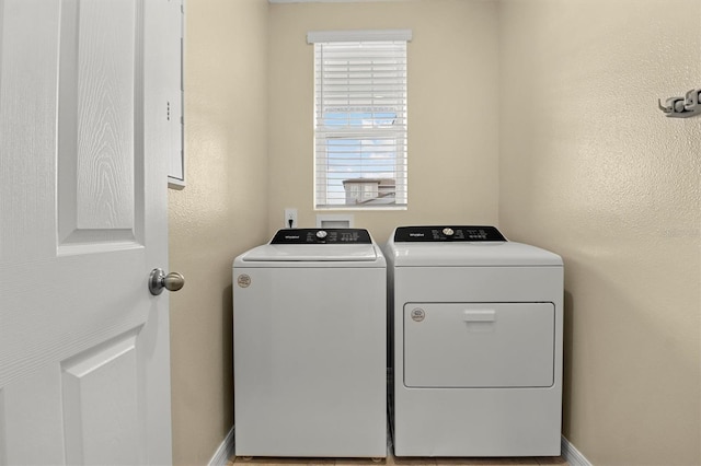 laundry area with washing machine and dryer