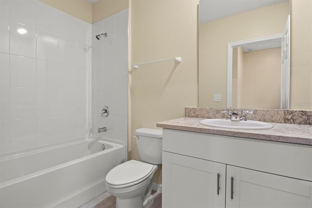 full bathroom featuring vanity, toilet, and tiled shower / bath combo