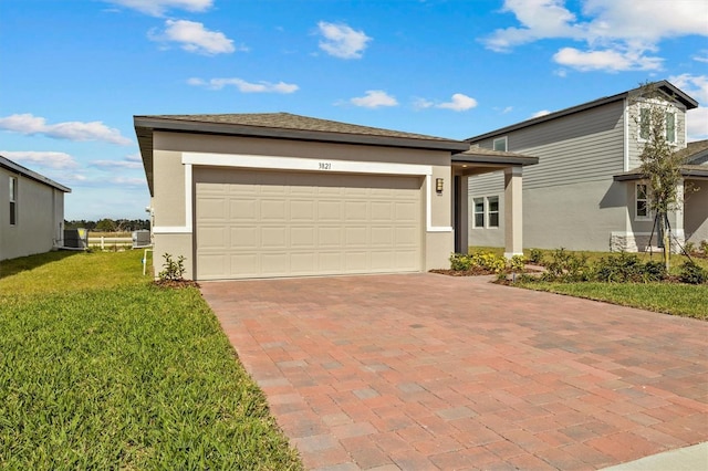 view of front facade with a garage and a front yard