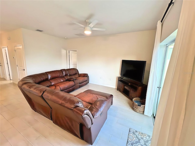 living room featuring ceiling fan