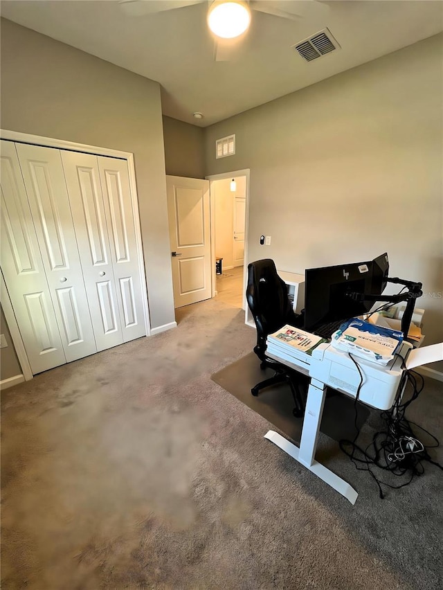 office space featuring ceiling fan and carpet flooring