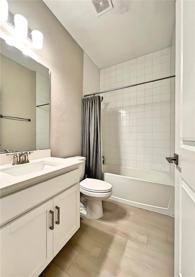 full bathroom featuring shower / bathtub combination with curtain, vanity, and toilet