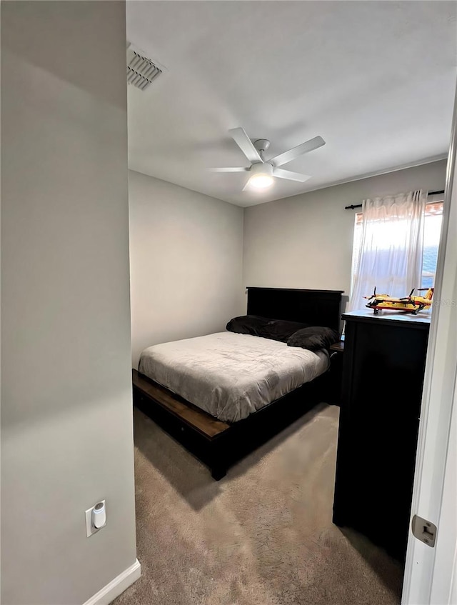 bedroom with ceiling fan and carpet