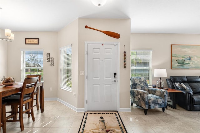 entryway featuring light tile patterned flooring and a healthy amount of sunlight