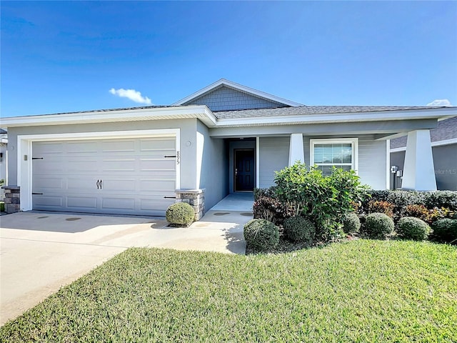 ranch-style house featuring concrete driveway, a front yard, stucco siding, stone siding, and an attached garage