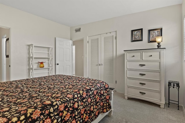 bedroom featuring light carpet and a closet