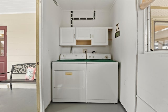 laundry area featuring cabinets and washer and clothes dryer