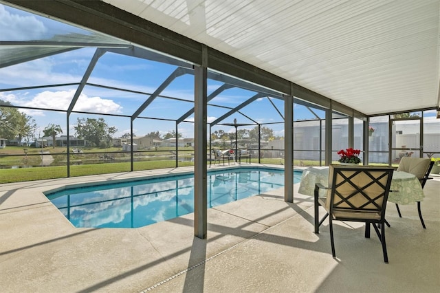 view of swimming pool with a patio and a lanai