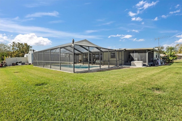 exterior space featuring a lanai, a lawn, and a sunroom