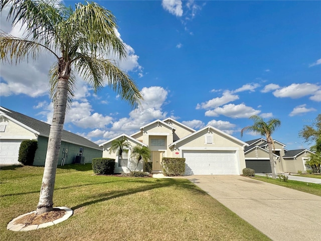 view of front of house with a garage and a front lawn