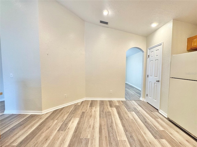 empty room with light wood-type flooring