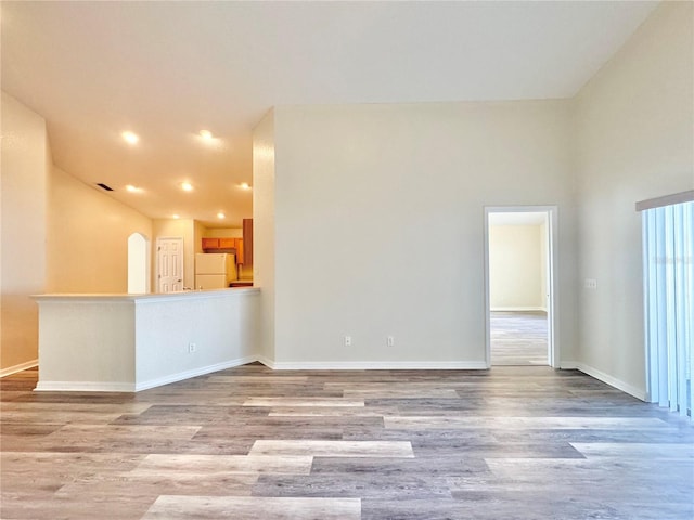 unfurnished living room featuring light hardwood / wood-style flooring