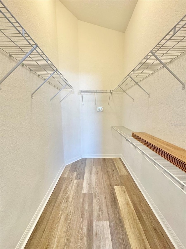 walk in closet featuring hardwood / wood-style floors