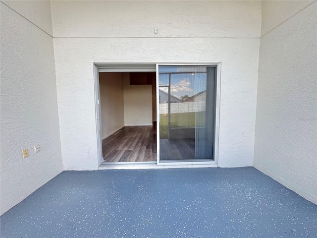 entrance to property with a balcony