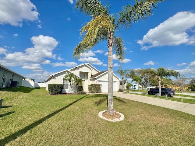 view of front facade featuring a garage and a front lawn