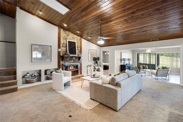 carpeted living room featuring high vaulted ceiling, wood ceiling, stairway, a ceiling fan, and a fireplace