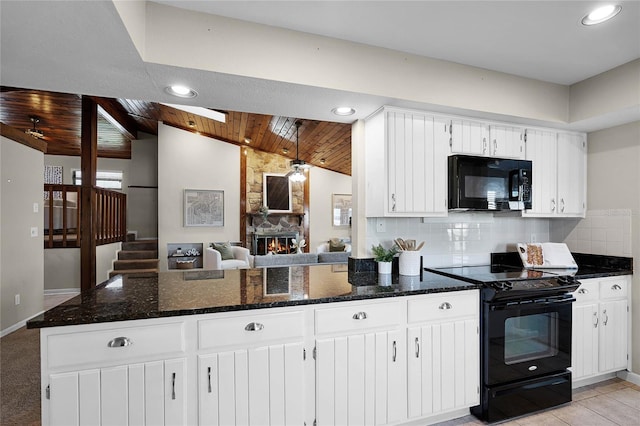 kitchen with decorative backsplash, black appliances, vaulted ceiling, and wooden ceiling