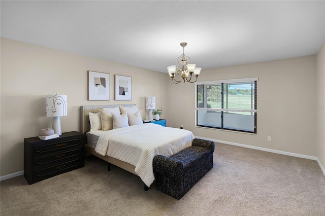 bedroom featuring baseboards, carpet flooring, and a chandelier