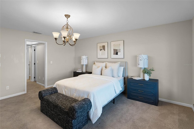 carpeted bedroom with a notable chandelier, baseboards, and visible vents