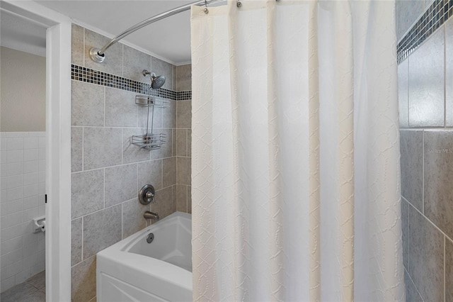 full bathroom with shower / bath combo and tile walls