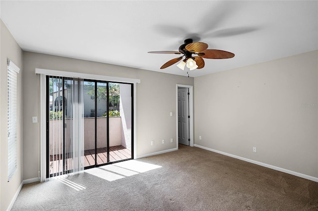 empty room with baseboards, carpet flooring, and a ceiling fan