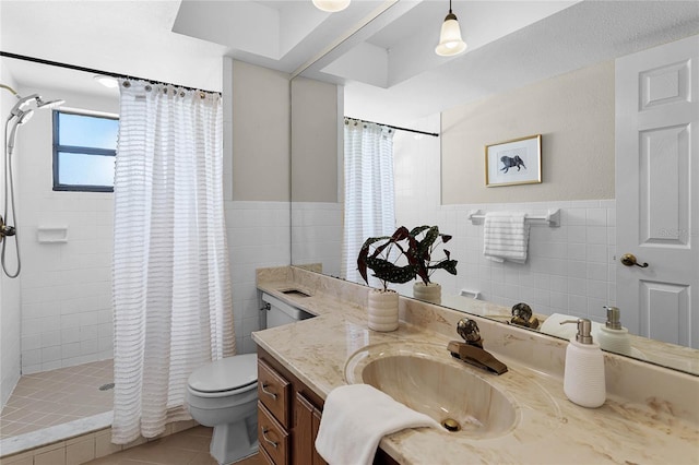 bathroom with tile walls, toilet, a tile shower, and tile patterned floors