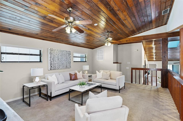 living area with a ceiling fan, carpet, a healthy amount of sunlight, and visible vents