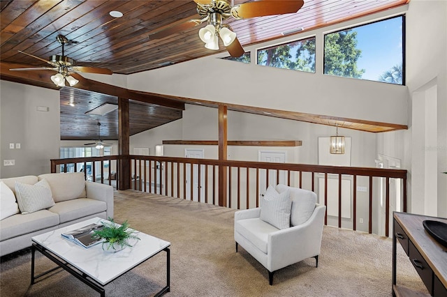 living room with a ceiling fan, wood ceiling, carpet, and high vaulted ceiling