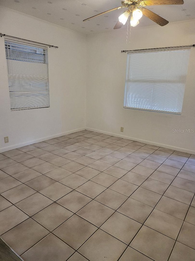 unfurnished room with ceiling fan