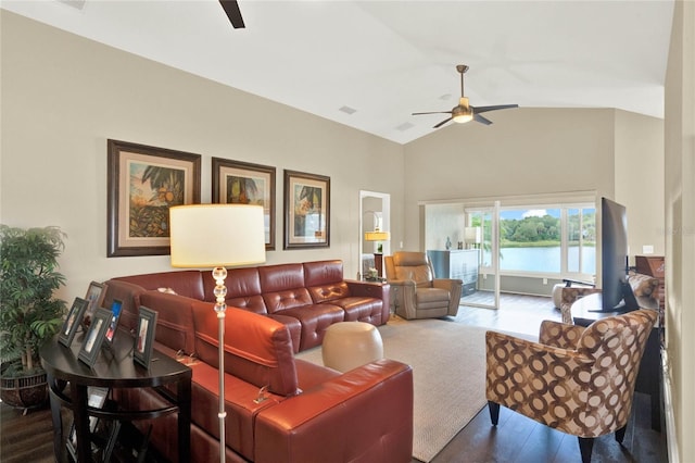 living room featuring hardwood / wood-style flooring, vaulted ceiling, and ceiling fan